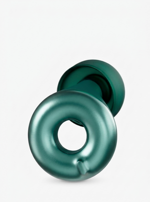 Close-up of a Silensea earplug in Forest Green showing the ring body and soft silicone tip