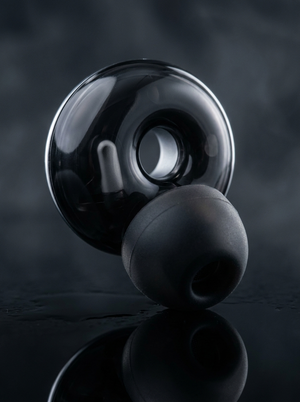 Close-up of a Silensea earplug in Midnight Black showing the ring body and soft silicone tip