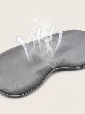 Silensea cooling sleep mask in Cloud Grey with arrows illustrating airflow across the satin surface